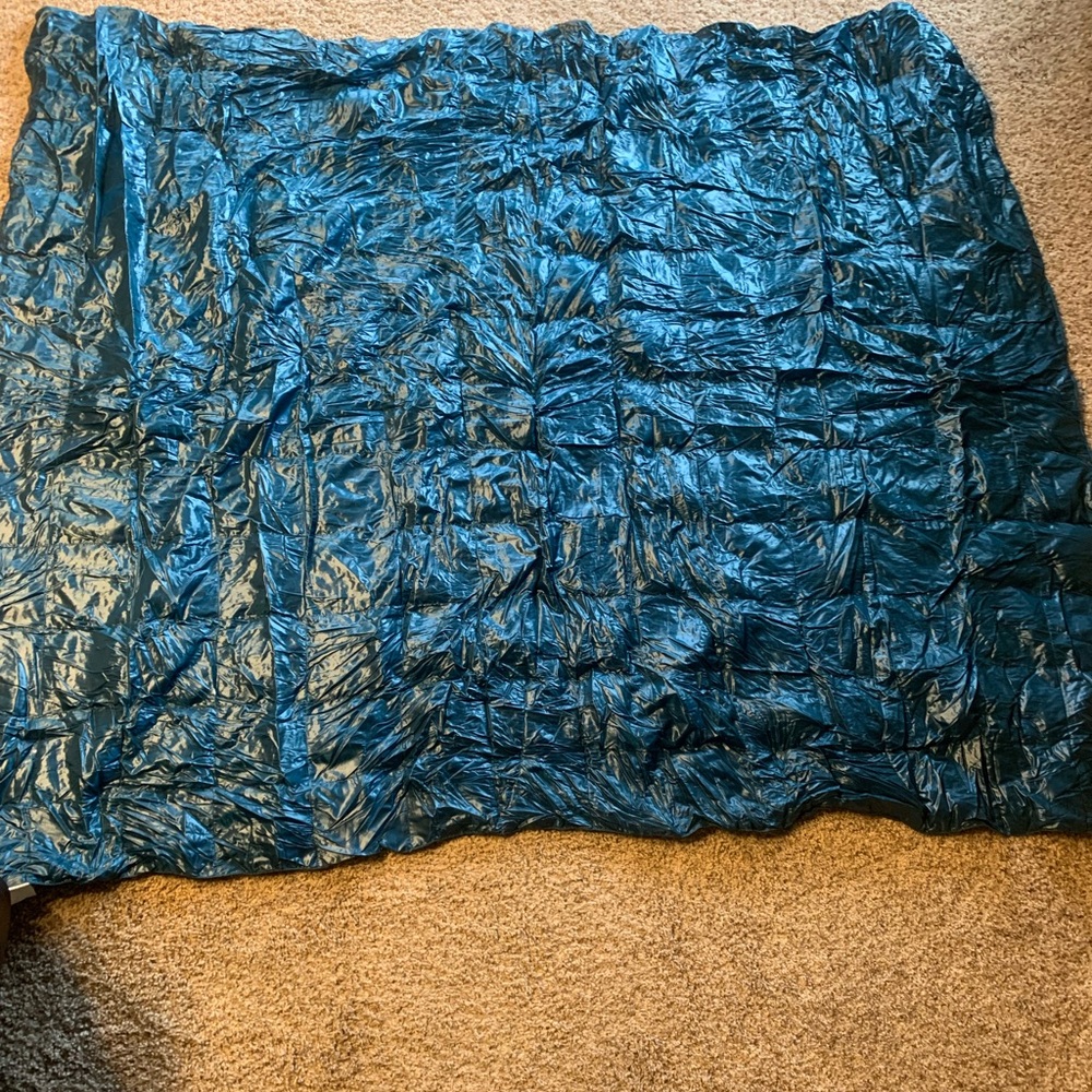 Blue Ridge teal packable down throw.
